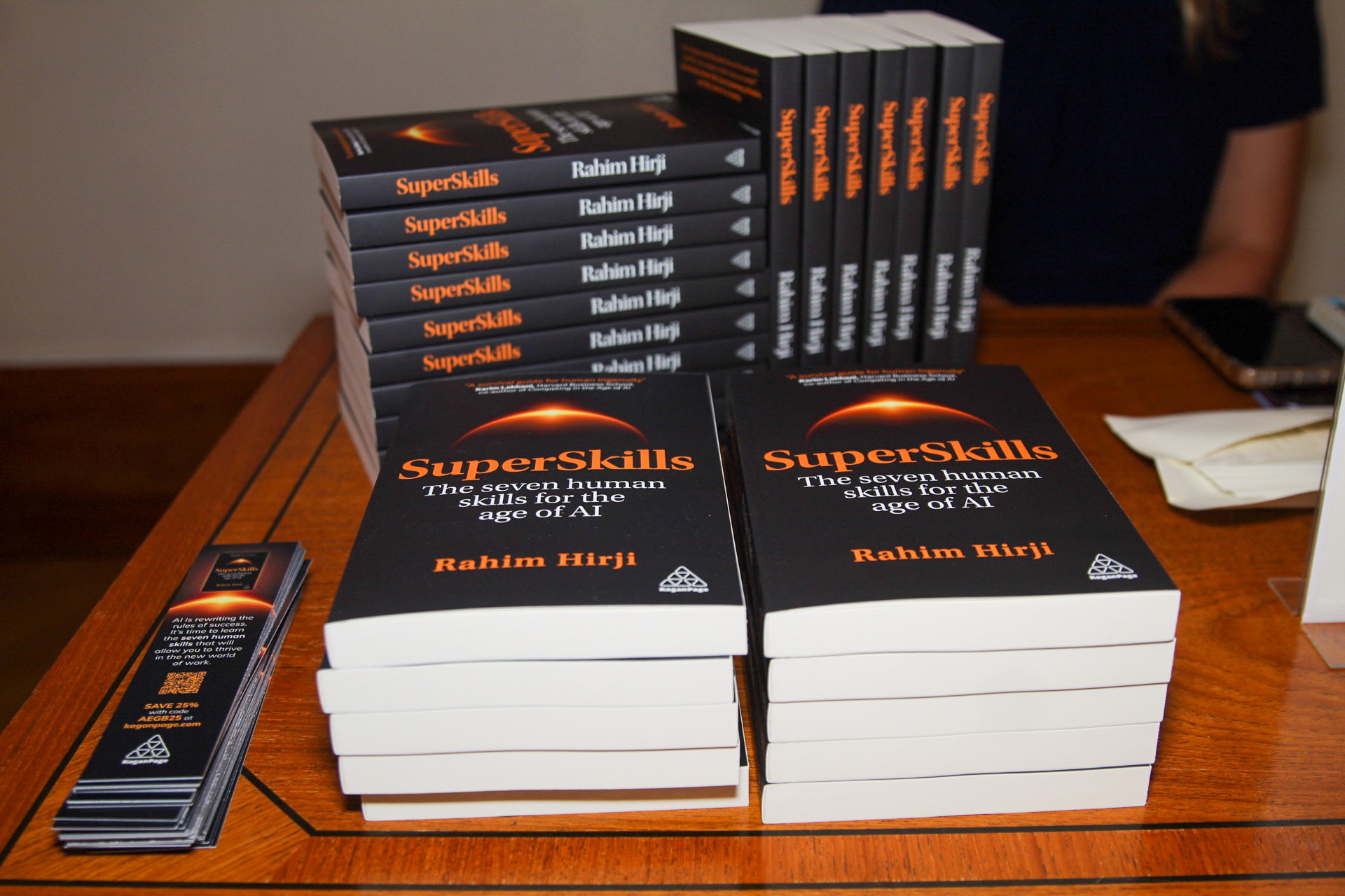 Copies of SuperSkills stacked on a table beside Kogan Page bookmarks
