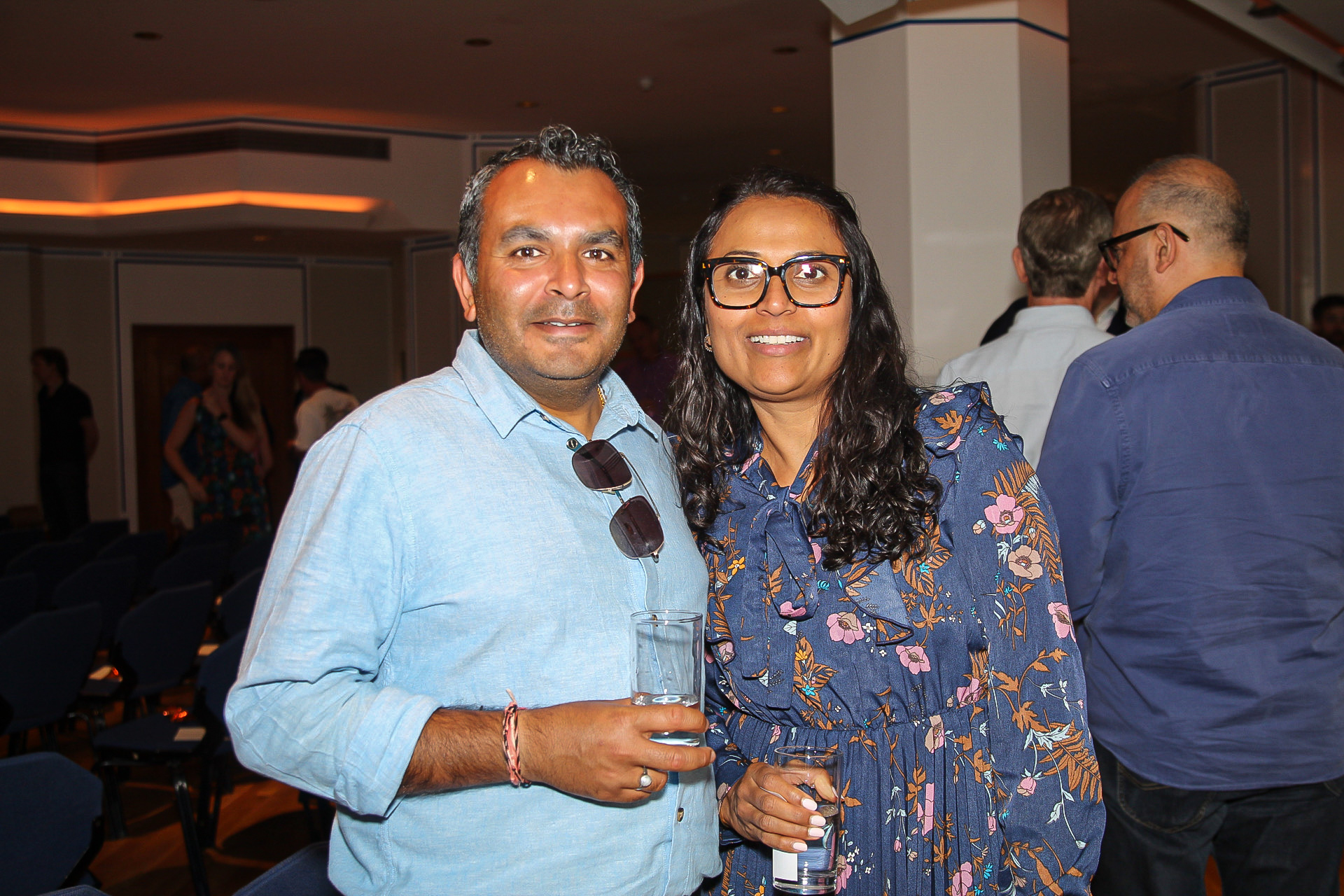 Two guests with drinks at the SuperSkills launch