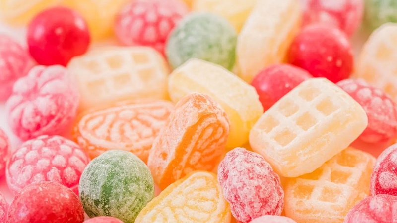 A close-up of a pick-and-mix of brightly coloured boiled sweets