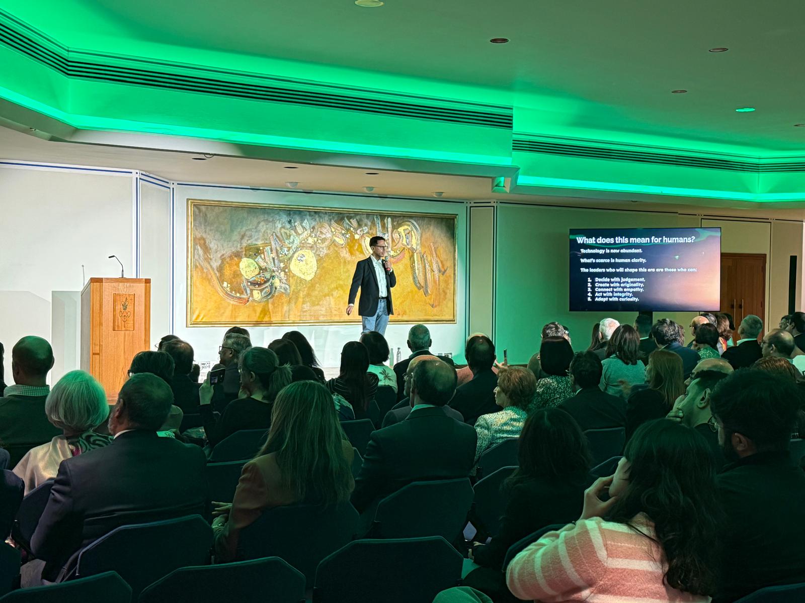Rahim Hirji speaking on stage
