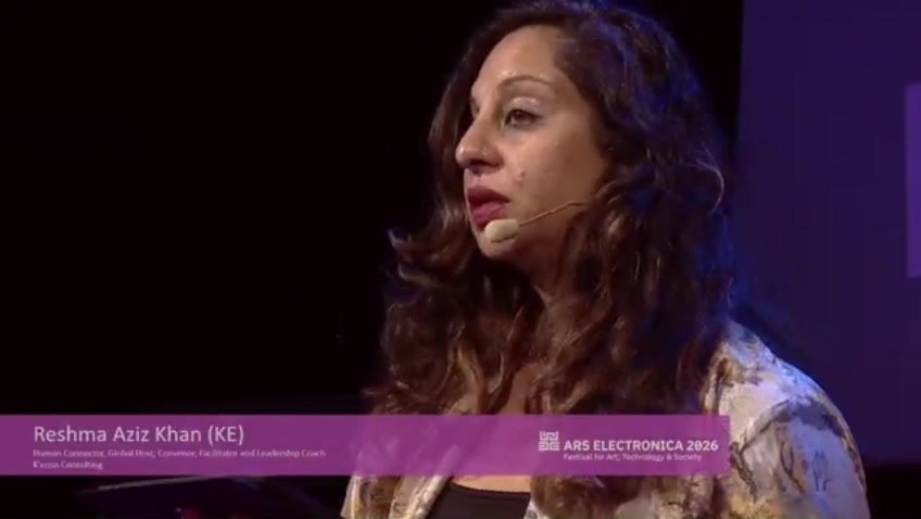 Reshma Aziz Khan on stage at Ars Electronica 2026 in Linz, reading from SuperSkills by Rahim Hirji
